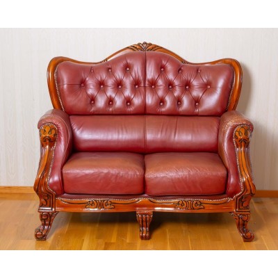 Rococo style two-seater leather sofa