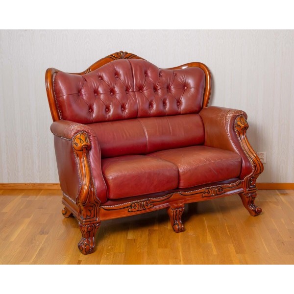 Rococo style two-seater leather sofa